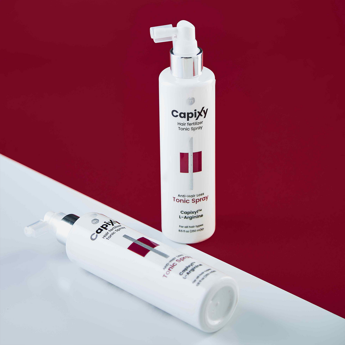 Capixy Tonic Spray applied to the scalp